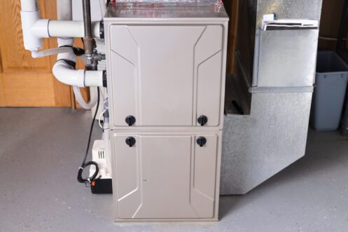 Double stage gas furnace in the basement of a Windsor home